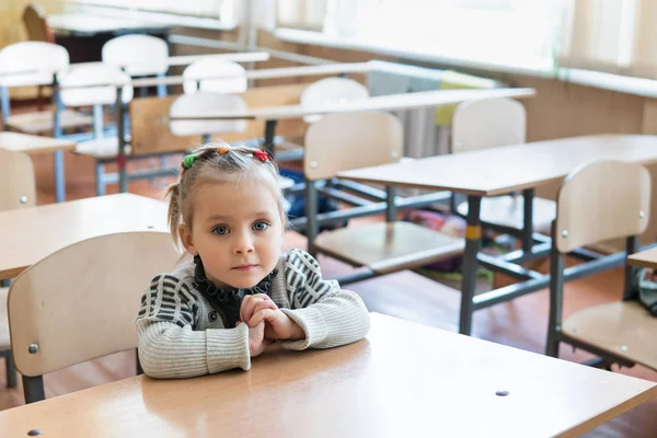 Portrait of little girl at the desk — Stock Photo, Image