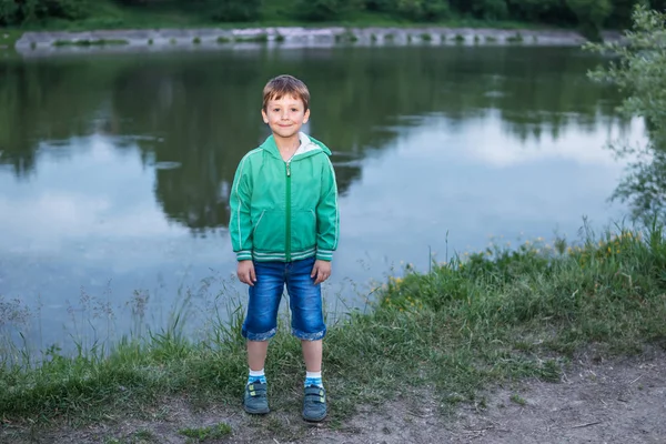 Portrait of a boy by the lake — Stock Photo, Image