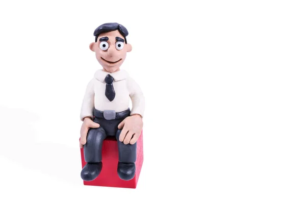 Portrait of a seated plasticine businessman — Stock Photo, Image