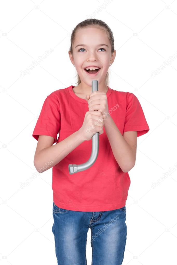 Girl singing into an imaginary microphone