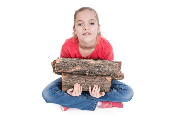 Girl with firewood — Stock Photo, Image