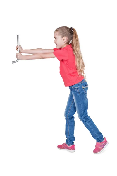 Girl is holding an automobile wrench — Stock Photo, Image