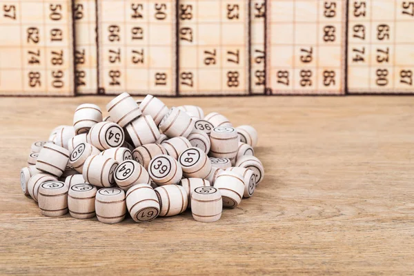 Bunch of lotto kegs on old table — Stock Photo, Image