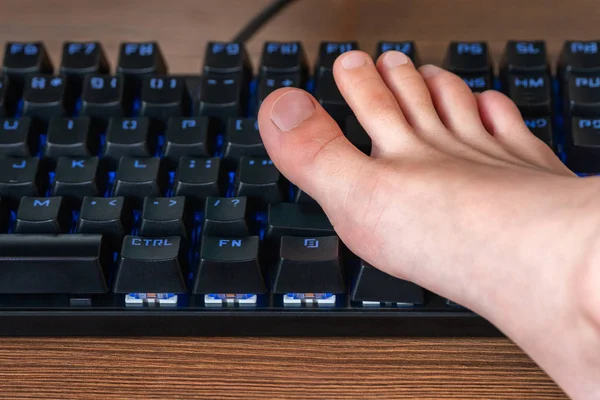 Children foot on the keyboard — Stock Photo, Image
