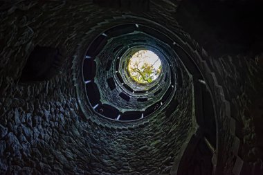 The famous Initiation Well at Quinta da Regaleira, Sintra, Portugal. clipart