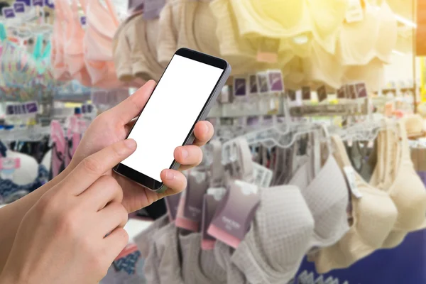 insan eli tutun ve dokunmatik ekranla akıllı telefon, tablet, bulanık iç çamaşırı Dükkanı cep telefonu.