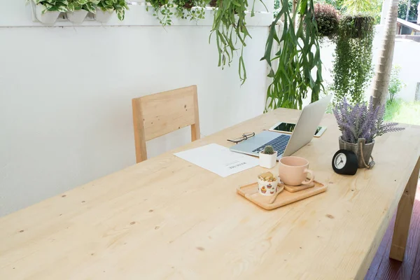 Office table with laptop, tablet and purple lavender flower on p — Stock Photo, Image