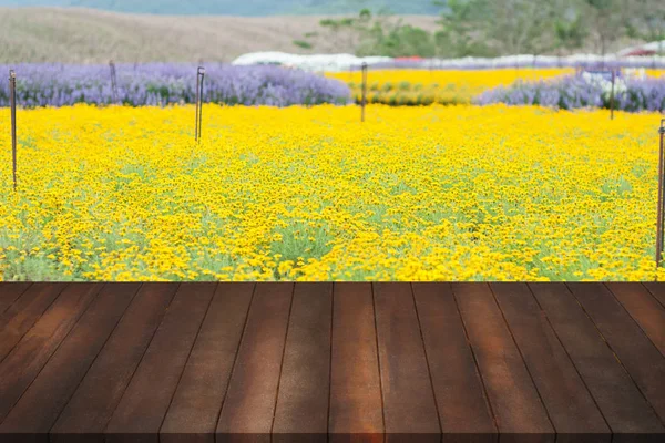 Montage of wood floor for advertisement on blurry yellow beautif — Stock Photo, Image