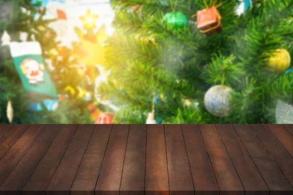 Montage of wood shelf for advertisement on blurry Christmas tree — Stock Photo, Image
