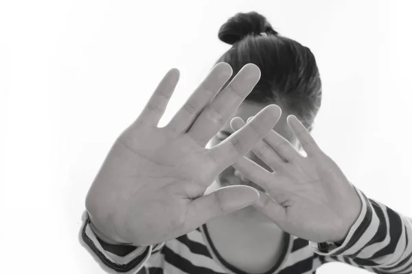 Young asian woman raise hand on isolated white background, conce Stock Image