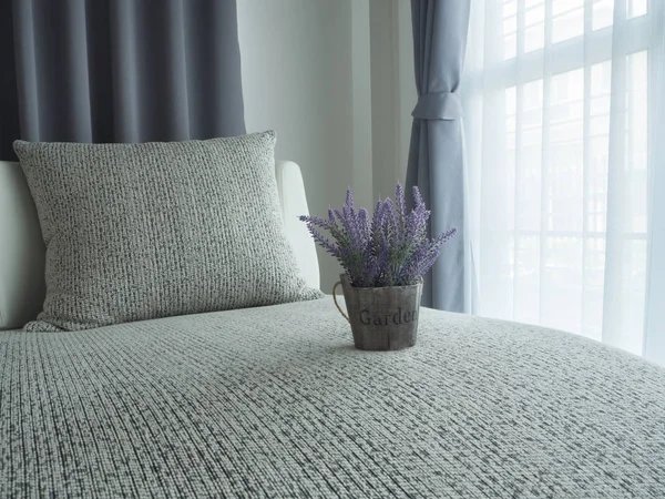 beautiful purple lavender flower on modern vintage sofa and blur