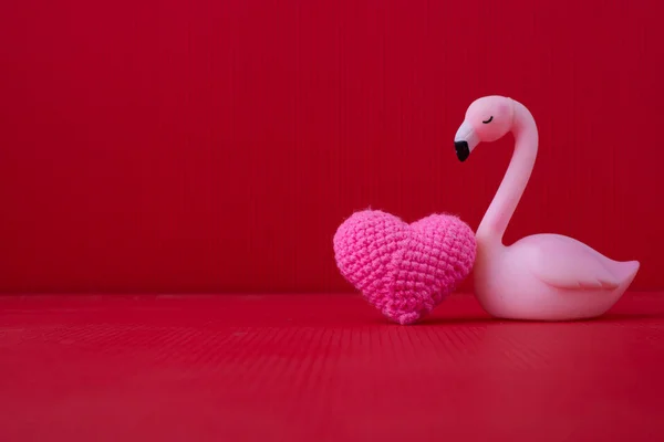 Copy space on Red Valentines background with Pink Alone bird toy — Stock Photo, Image