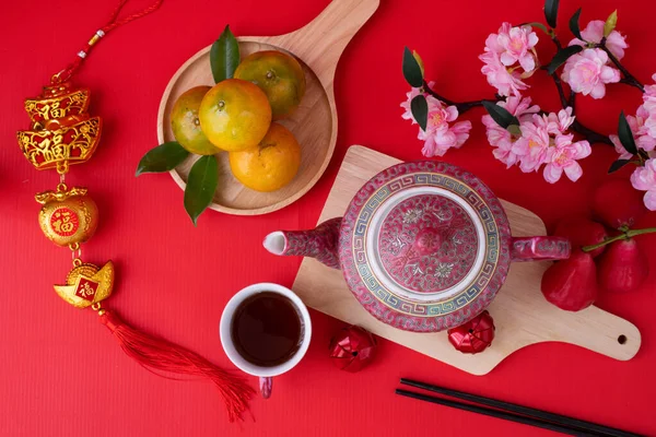 Red Chinese new year background concept with teapot and Sakura f 로열티 프리 스톡 이미지