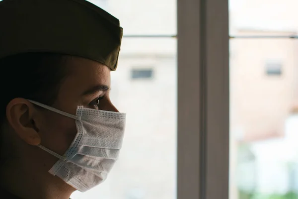 Portrait of a female army officer in uniform and surgical mask. Fighting against the virus. Pandemic coronavirus. Portrait army series. Army portrait series.