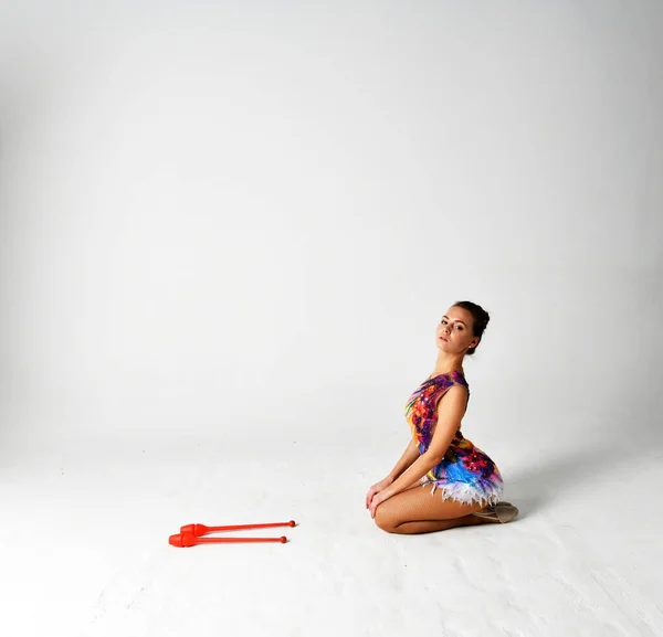Gymnast Bright Suit Dancing Red Clubs — Stock Photo, Image