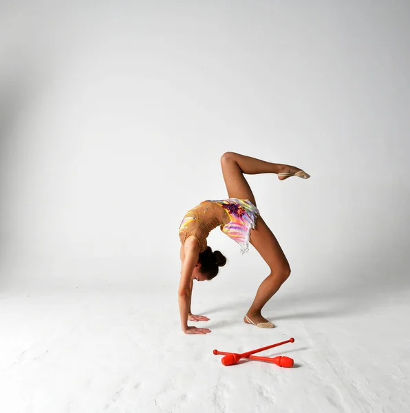 Gymnast Bright Suit Dancing Red Clubs — Stock Photo, Image