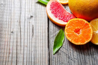 Narenciye - limon, mandalina, greyfurt, üstten görünüm alanı Kopyala