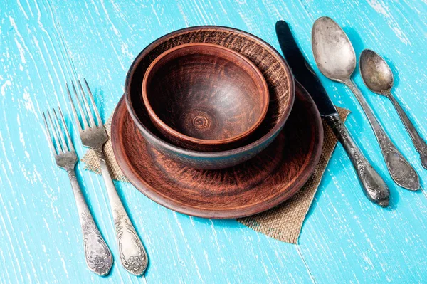 Vintage tableware, cutlery on blue wooden backround
