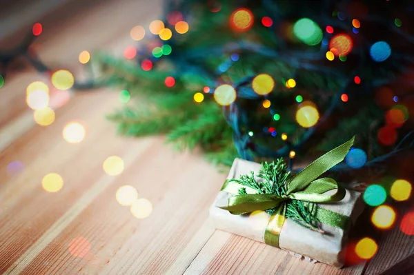 New Years gift near the Christmas tree. — Stock Photo, Image