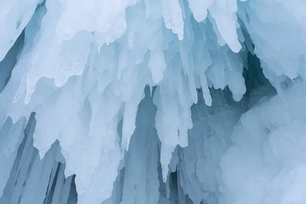 Blue ice stalactite on cliff in winter season, nature background — Stock Photo, Image