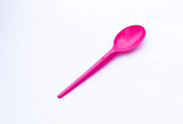One Vibrant Pink Plastic Spoon Isolated White — Stock Photo, Image