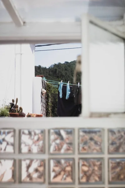 Socks hanging viewed from a window