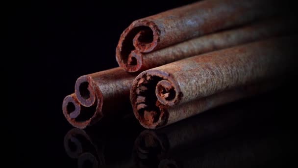 Slow Rotation Cinnamon Sticks Black Background — Stock Video