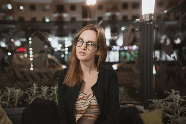 Portrait of beautiful brunette girl in cafe or bar. Leisure holiday concept. Pretty smiling attractive young woman in glasses — Stock Photo, Image