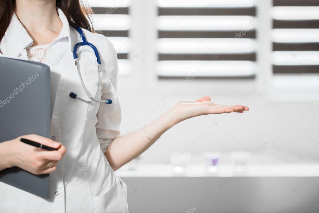 Medical cure and tests advertisement concept. Physician ready to examine and save patient.Female medicine doctor offering helping hand in office closeup
