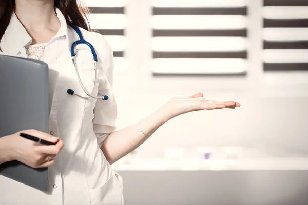 Medical cure and tests advertisement concept. Physician ready to examine and save patient.Female medicine doctor offering helping hand in office closeup