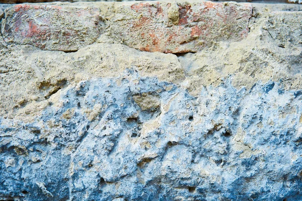 Background stone texture. Hard old painted wall in grunge style. Surface for design and text. Close up view — Stock Photo, Image