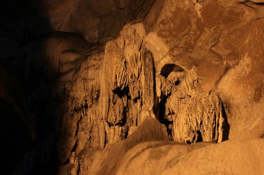 The Borra caves are located on the East coast of India, in the Ananthagiri hills of the Araku valley, Visakhapatnam district in Andhra Pradesh, India. Formations of rocks inside Borra Caves. Stalactite and Stalagmite caves in India. clipart