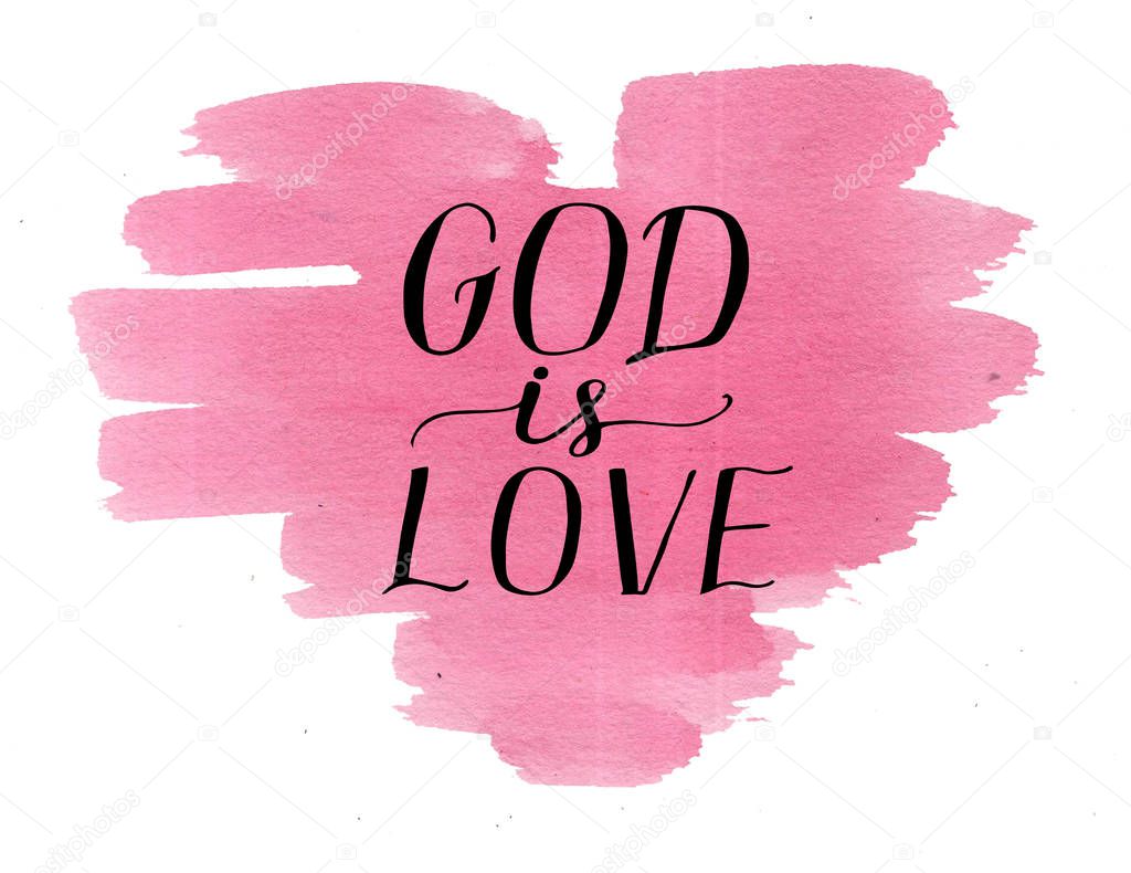 Hand lettering God is love on watercolor pink heart.