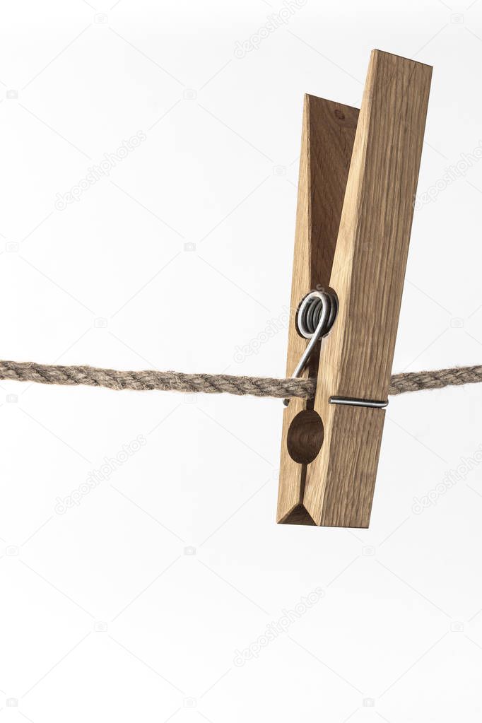 Wooden clothespin on rope