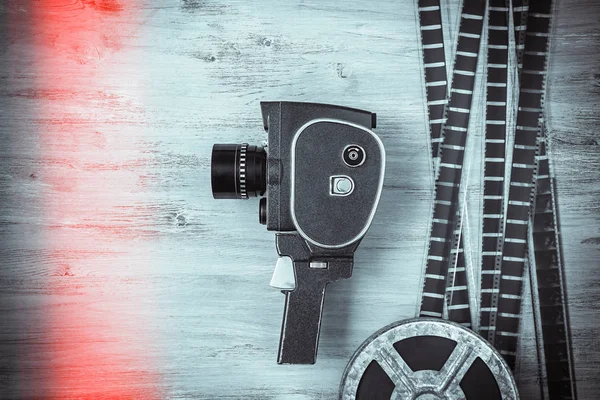 Old movie camera and film — Stock Photo, Image