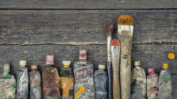 Artist brush and paint tubes