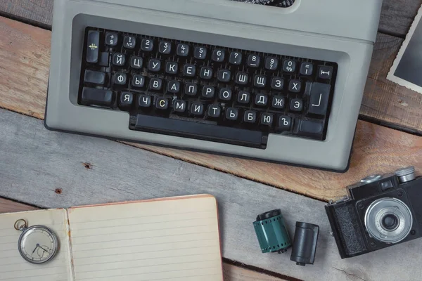 Typewriter, camera and pocket watch — Stock Photo, Image