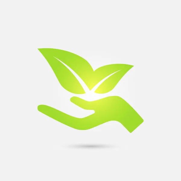 Экологическая икона. Человеческая рука выращивает зеленые листья . — стоковый вектор