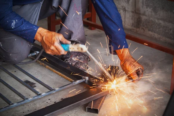 Welder working in a factory