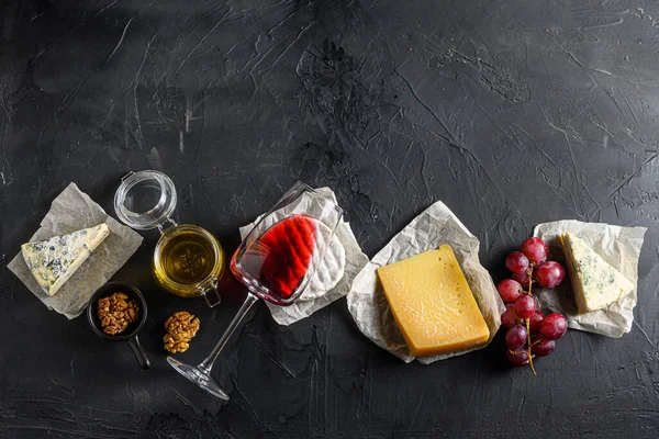 Assortment Cheeses Camembert Antipasto Glass Red Wine Honey Nuts Spices — Stock Photo, Image