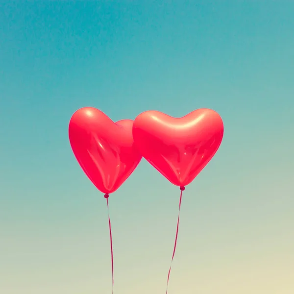 Two red heart shaped balloons — Stock Photo, Image