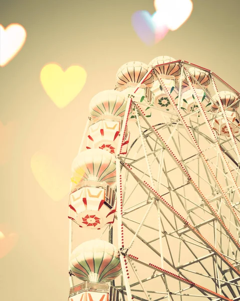 Vintage ferris wheel with hearts — Stock Photo, Image