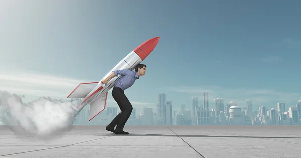 Business man holding jet pack rocket — Stock Photo, Image