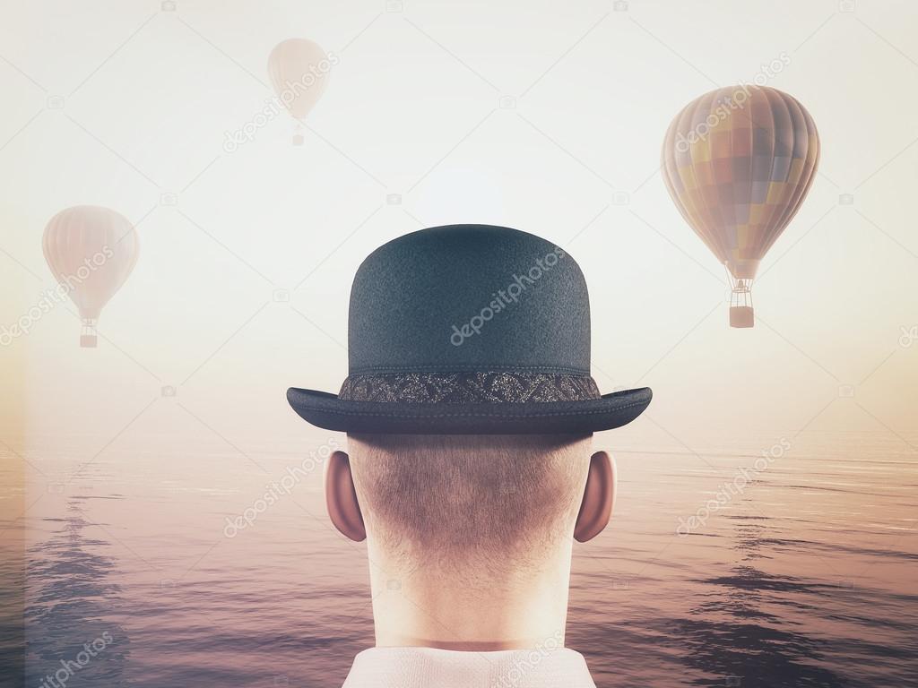 Man looking  at hot air balloons