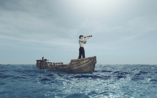 Man watching through a spyglass