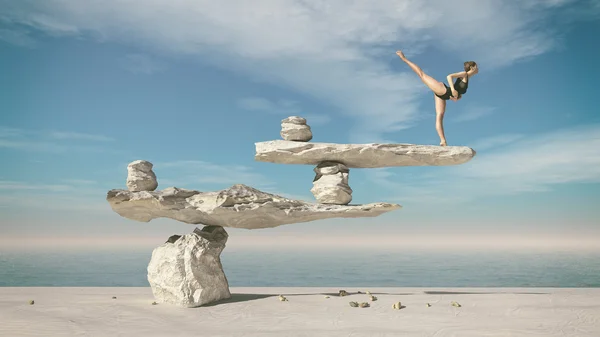 Молода гімнастка сидить на камені — стокове фото