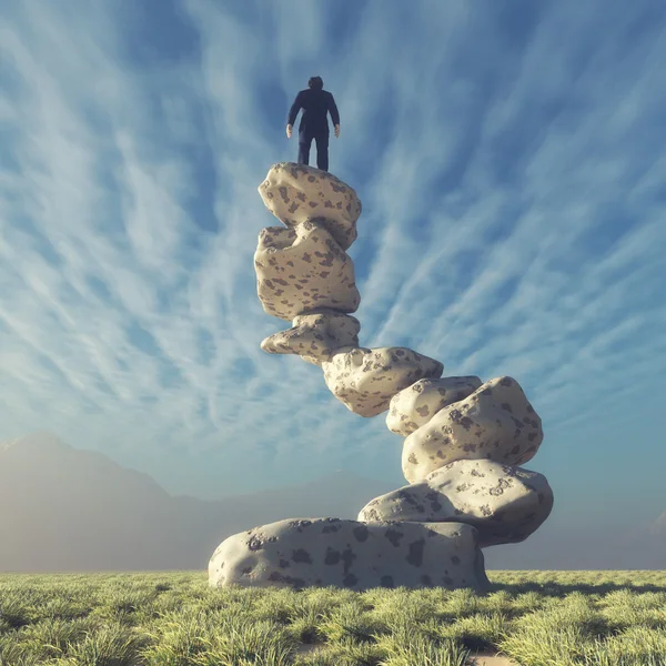 Bir adam kayalar üzerine silüeti — Stok fotoğraf