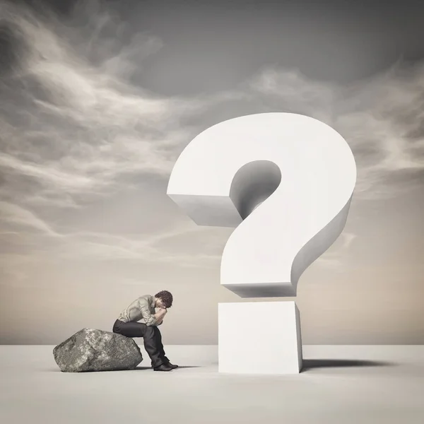 Young man sitting on a rock — Stock Photo, Image