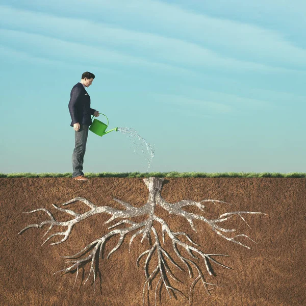Man watering with watering — Stock Photo, Image