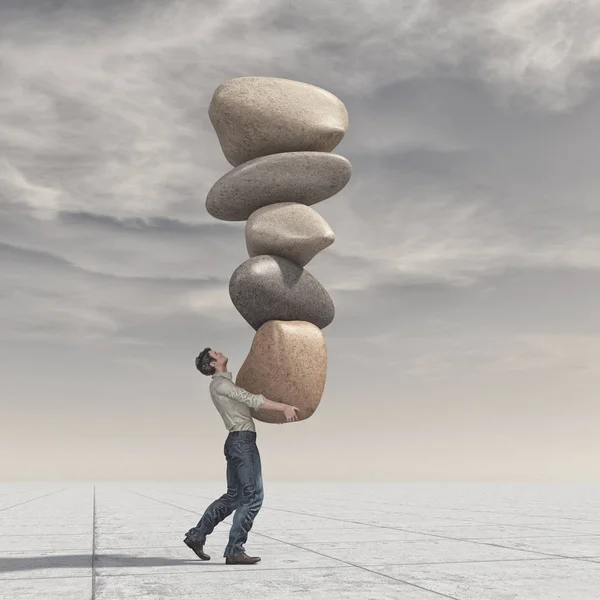 Jonge man op een stapel stenen in evenwicht — Stockfoto